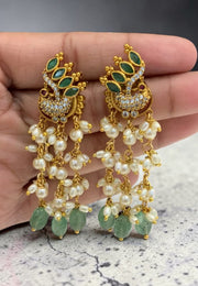 Beautiful earrings with peacock design and pearls